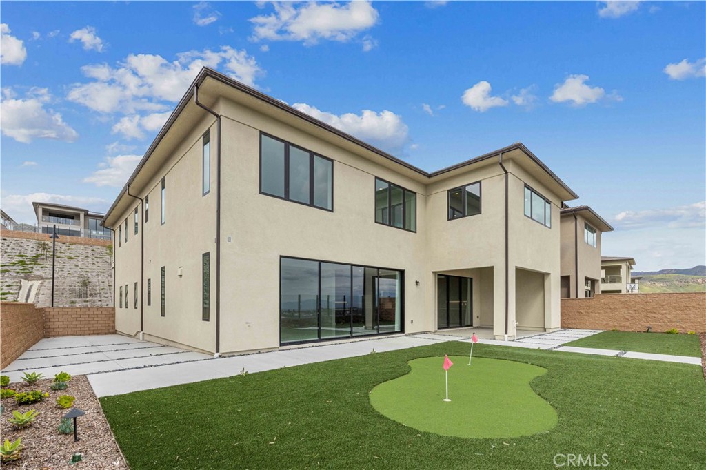 11752 Hillsborough Lane Porter Ranch, CA 91326 - Photo 2 of 45 a front view of a house with a yard