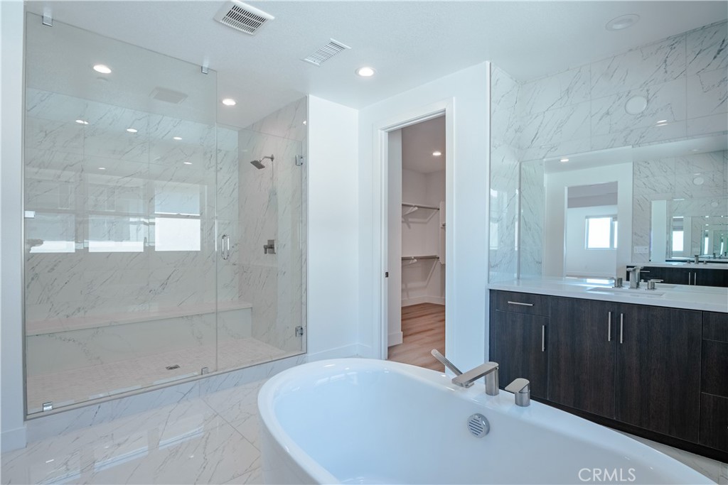 11752 Hillsborough Lane Porter Ranch, CA 91326 - Photo 28 of 45 a bathroom with a bathtub and a sink