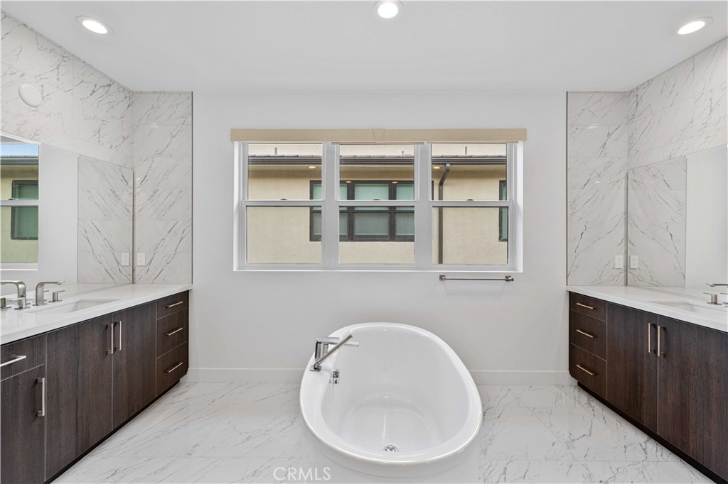 11752 Hillsborough Lane Porter Ranch, CA 91326 - Photo 29 of 45 a bathroom with a sink and a mirror