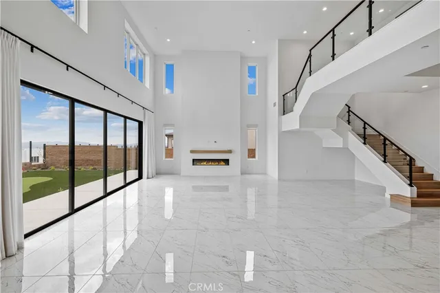 a kitchen with stainless steel appliances granite countertop a sink and a refrigerator