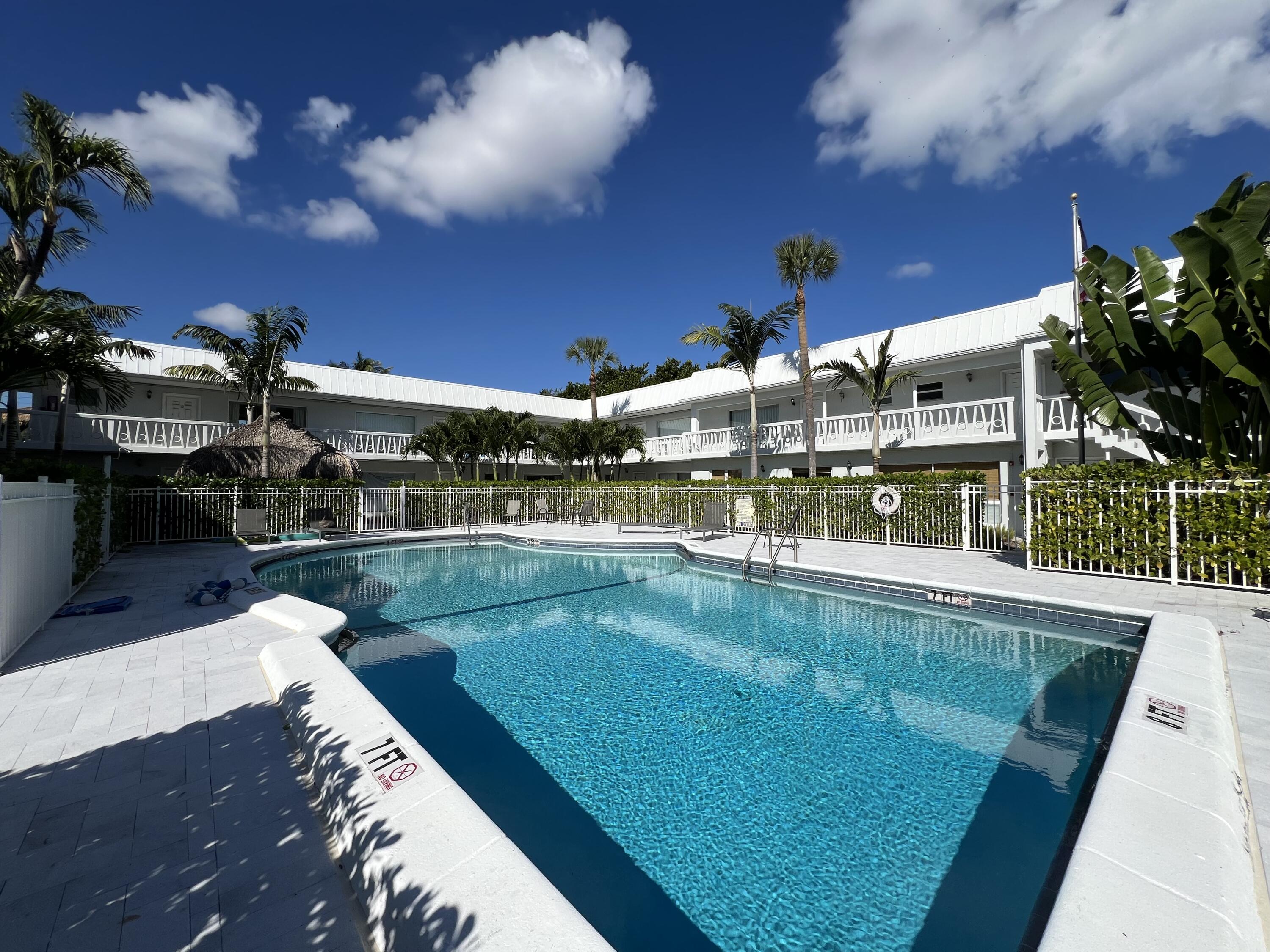 6600 North Ocean Boulevard, Unit 17 Ocean Ridge, FL 33435 - Photo 7 of 21 a view of a swimming pool with a patio