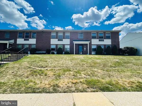 a view of a patio with a table and chairs