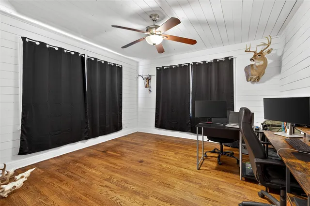 a bedroom with a bed and a desk