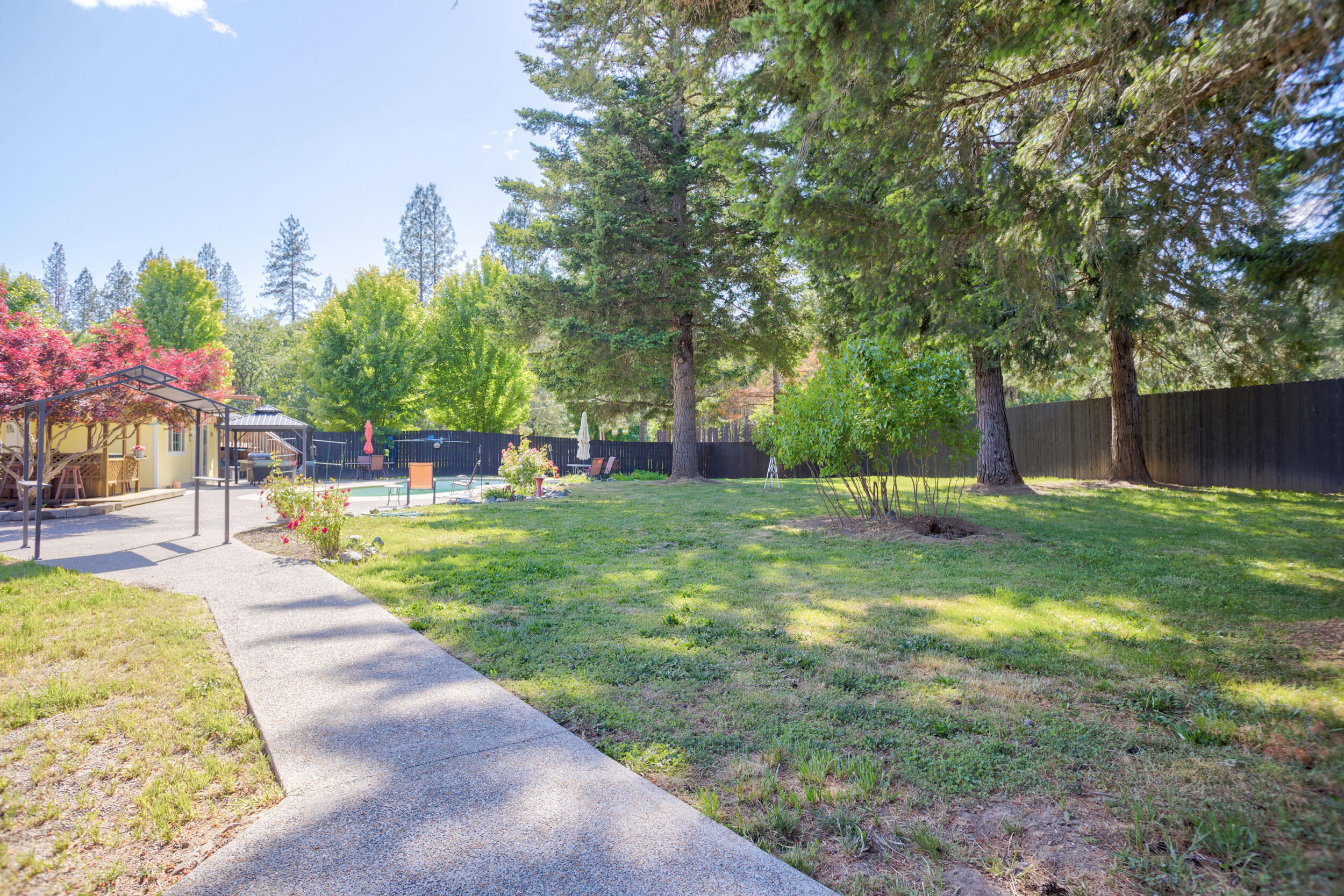 255 Queens Branch Road Rogue River, OR 97537 - Photo 54 of 60 a view of yard with swimming pool and green space