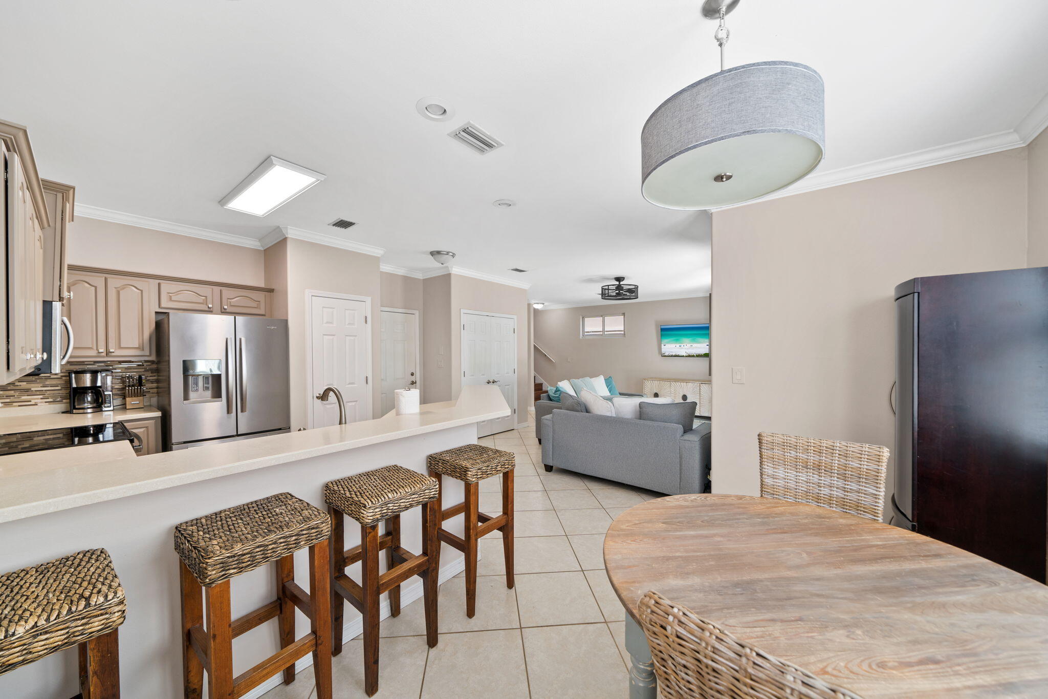 229 Inverrary Drive Destin, FL 32541 - Photo 11 of 35 a large kitchen with a table and chairs