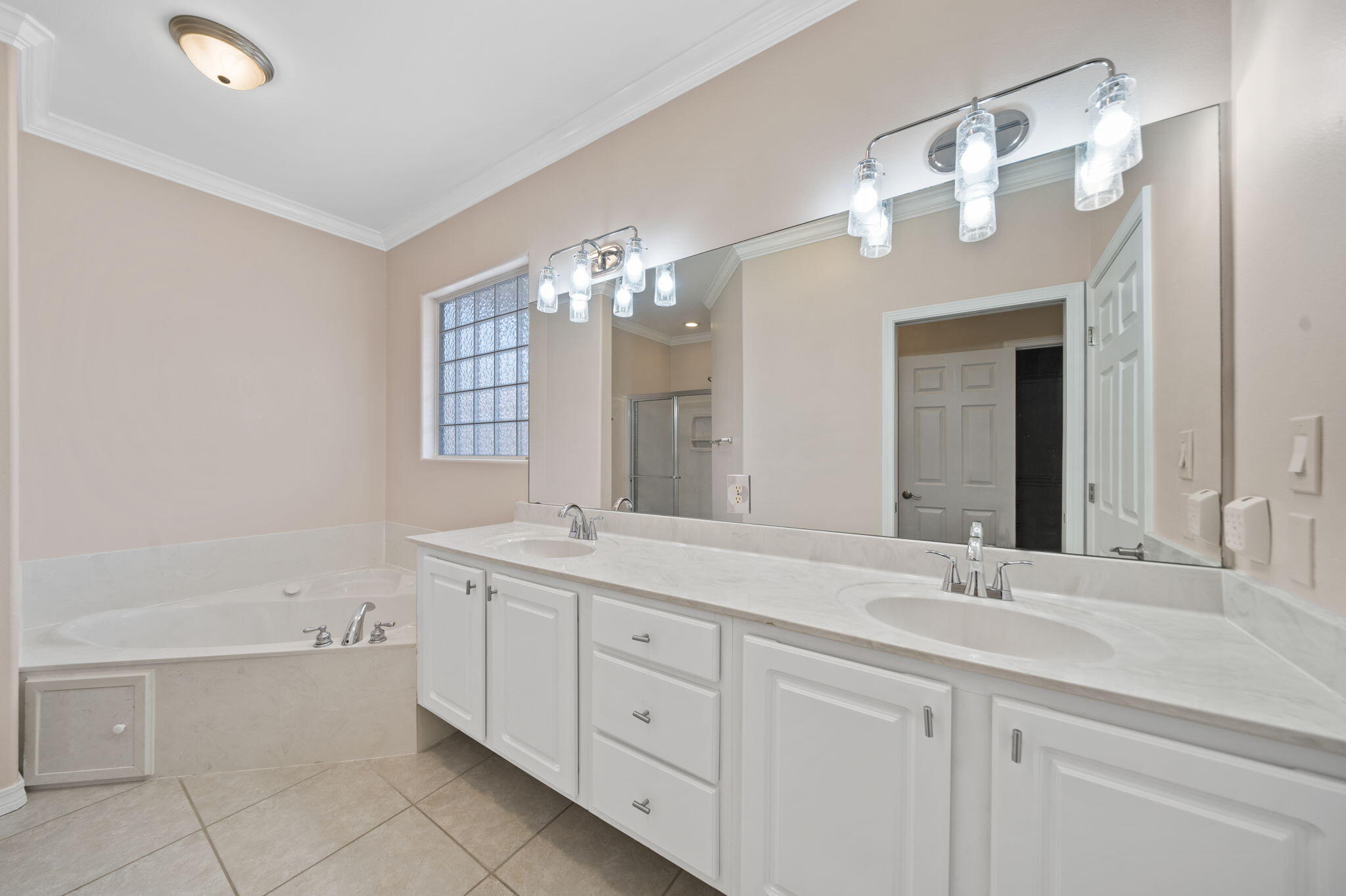 229 Inverrary Drive Destin, FL 32541 - Photo 20 of 35 a bathroom with a sink vanity and a mirror