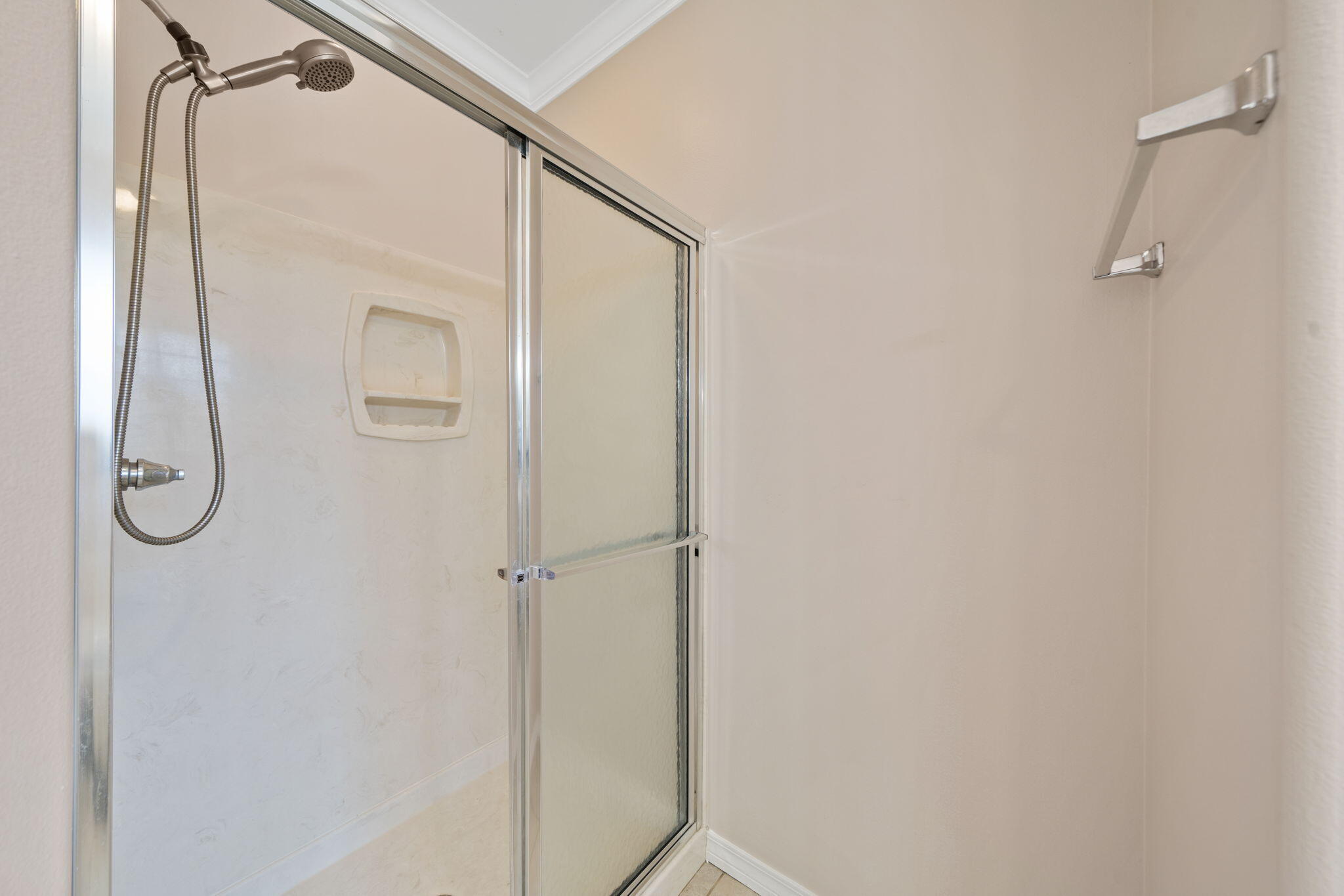 229 Inverrary Drive Destin, FL 32541 - Photo 22 of 35 a bathroom with a glass shower door
