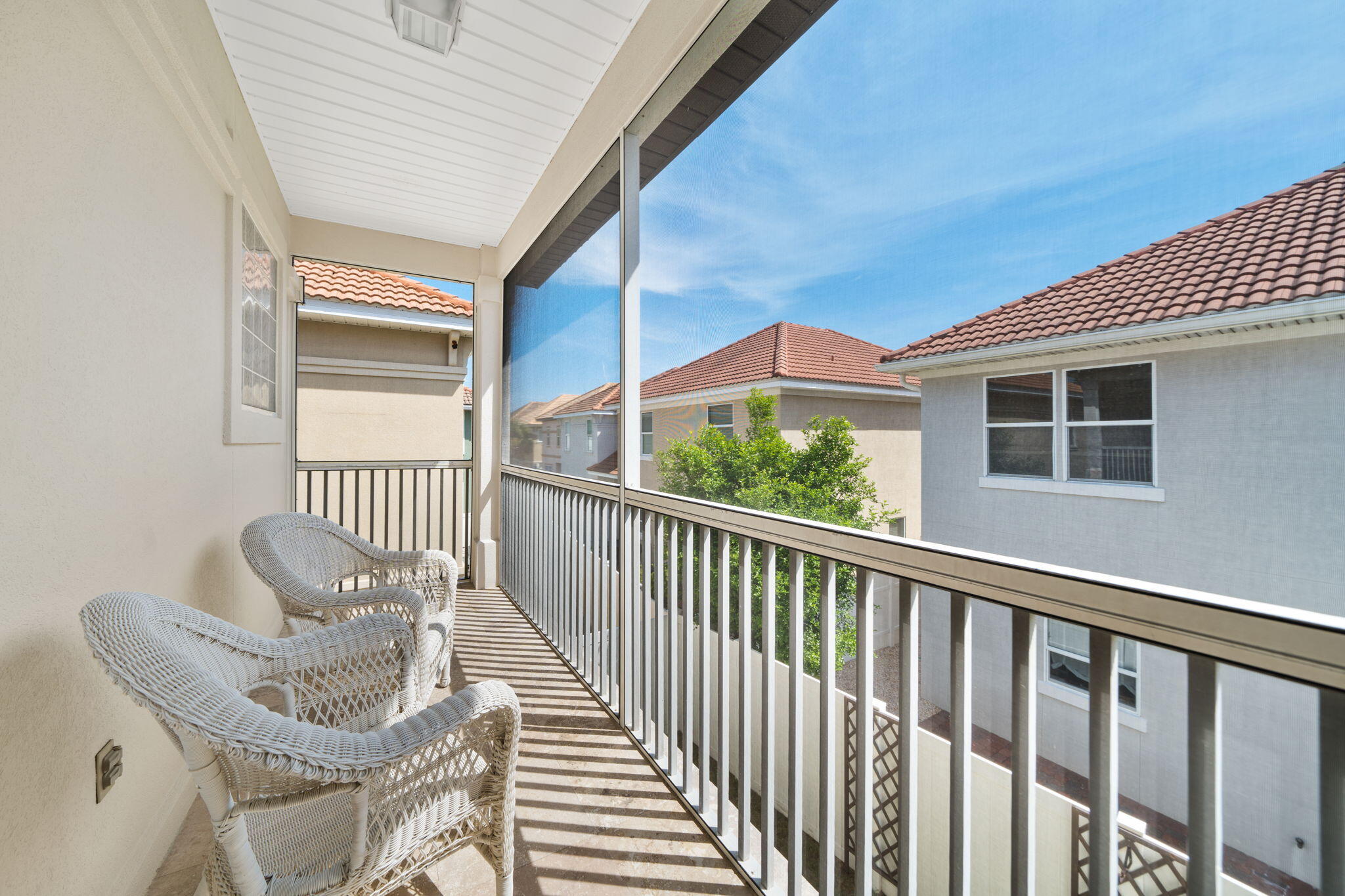 229 Inverrary Drive Destin, FL 32541 - Photo 25 of 35 a view of a balcony with chair and a table
