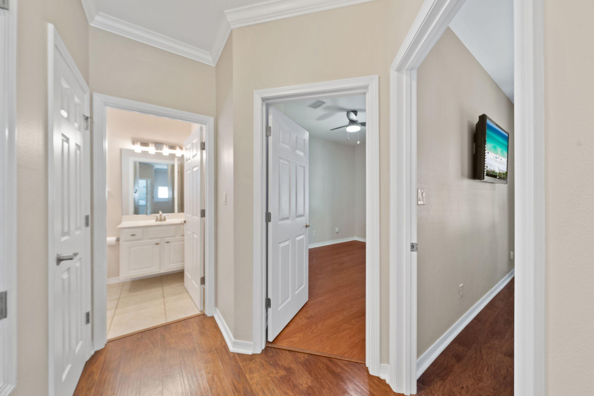 229 Inverrary Drive Destin, FL 32541 - Photo 26 of 35 a view of a hallway with wooden floor and a bathroom