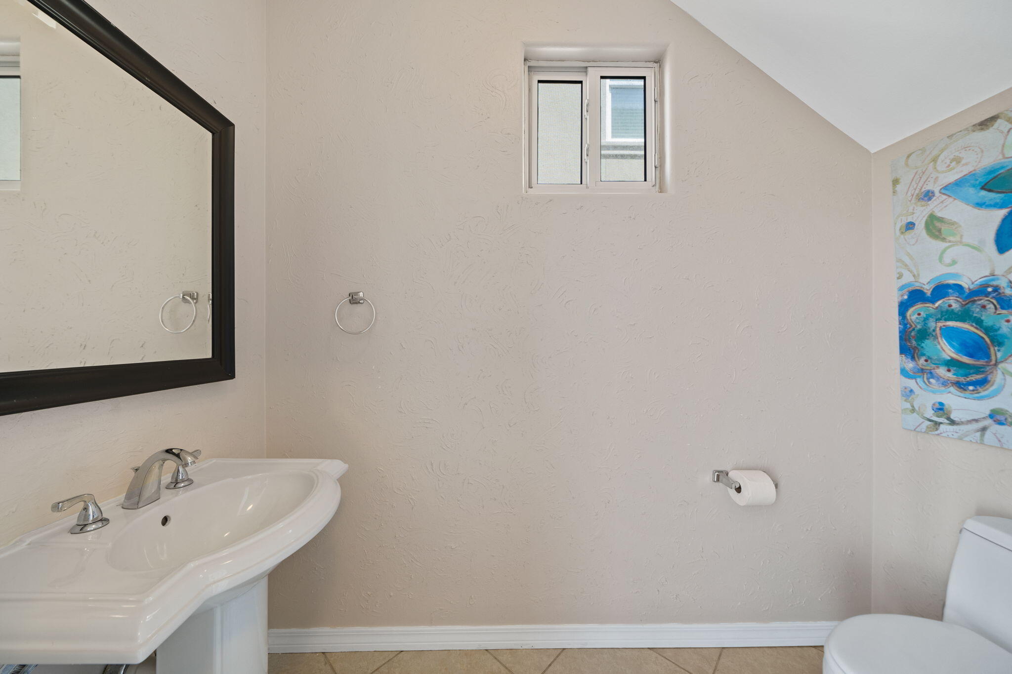 229 Inverrary Drive Destin, FL 32541 - Photo 6 of 35 a bathroom with a sink mirror and toilet