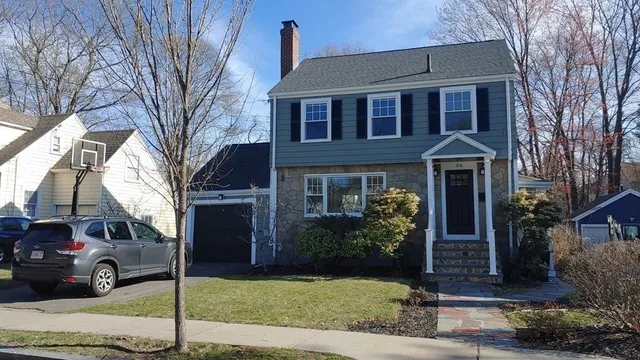 a front view of a house with garden