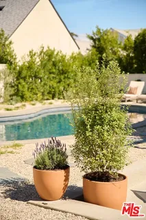 a view of a back yard of the house and green space