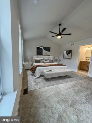a view of a livingroom with a ceiling fan and window