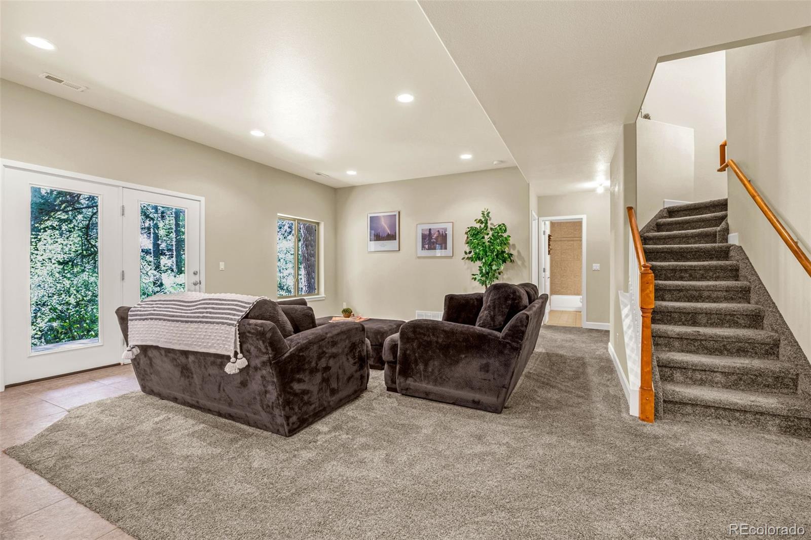 4775 Neeper Valley Road Manitou Springs, CO 80829 - Photo 20 of 41 a living room with furniture and a large window