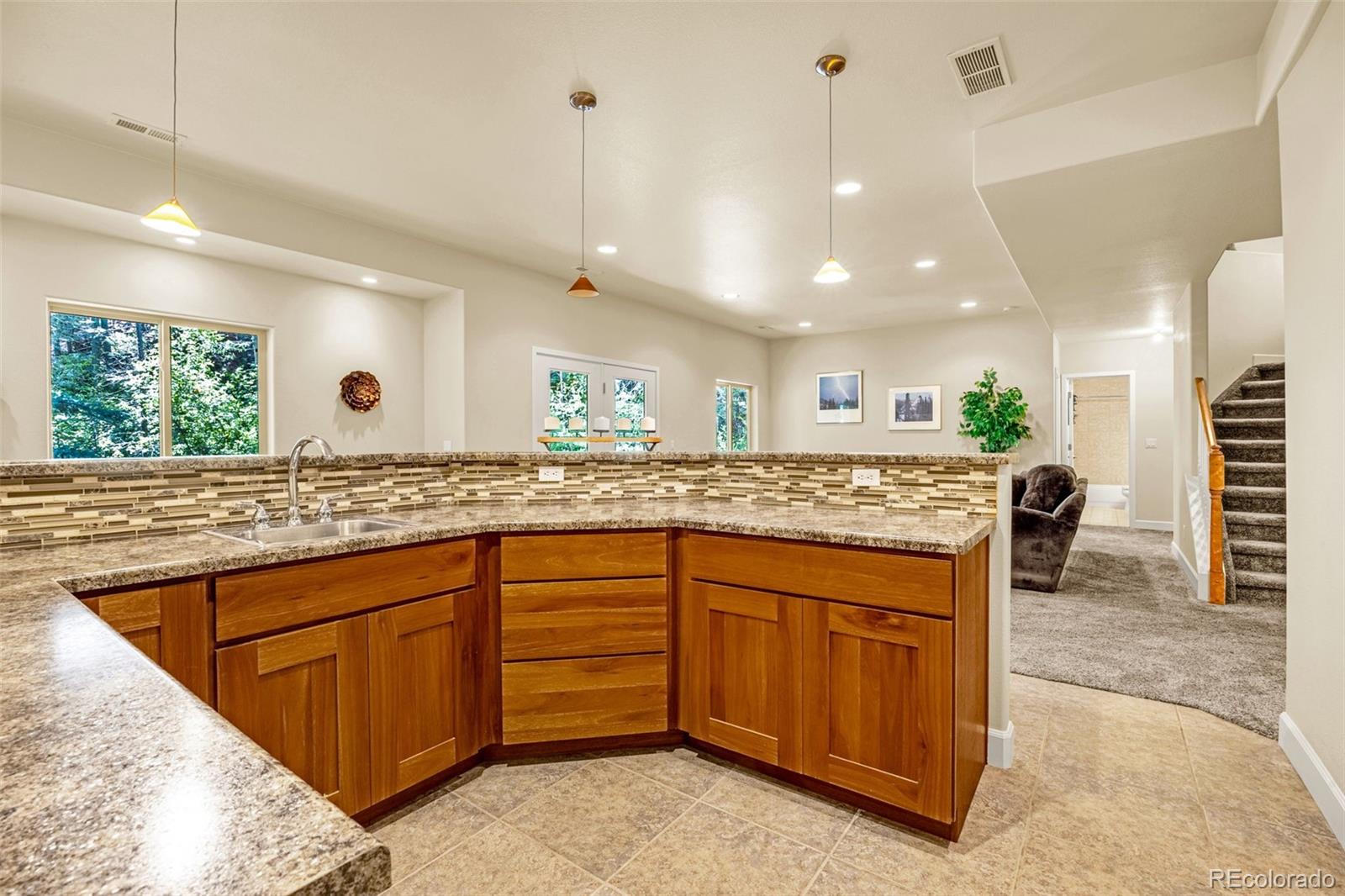 4775 Neeper Valley Road Manitou Springs, CO 80829 - Photo 23 of 41 a kitchen with a sink and window