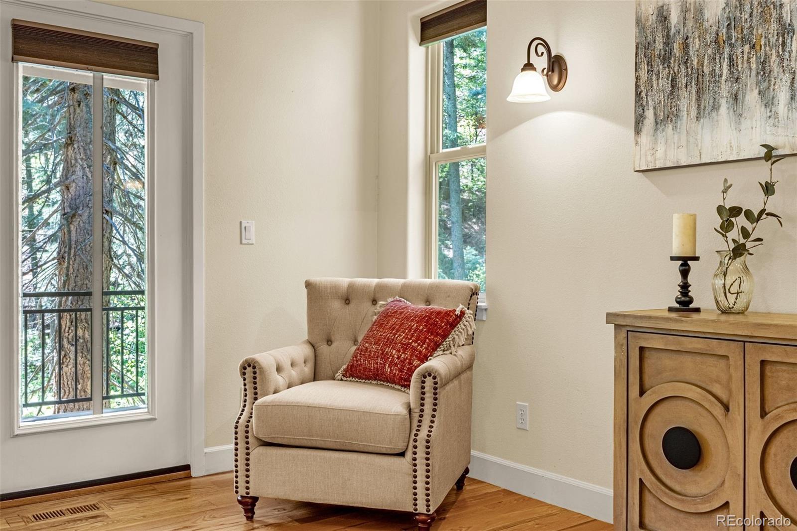 4775 Neeper Valley Road Manitou Springs, CO 80829 - Photo 29 of 41 a living room with furniture and a window