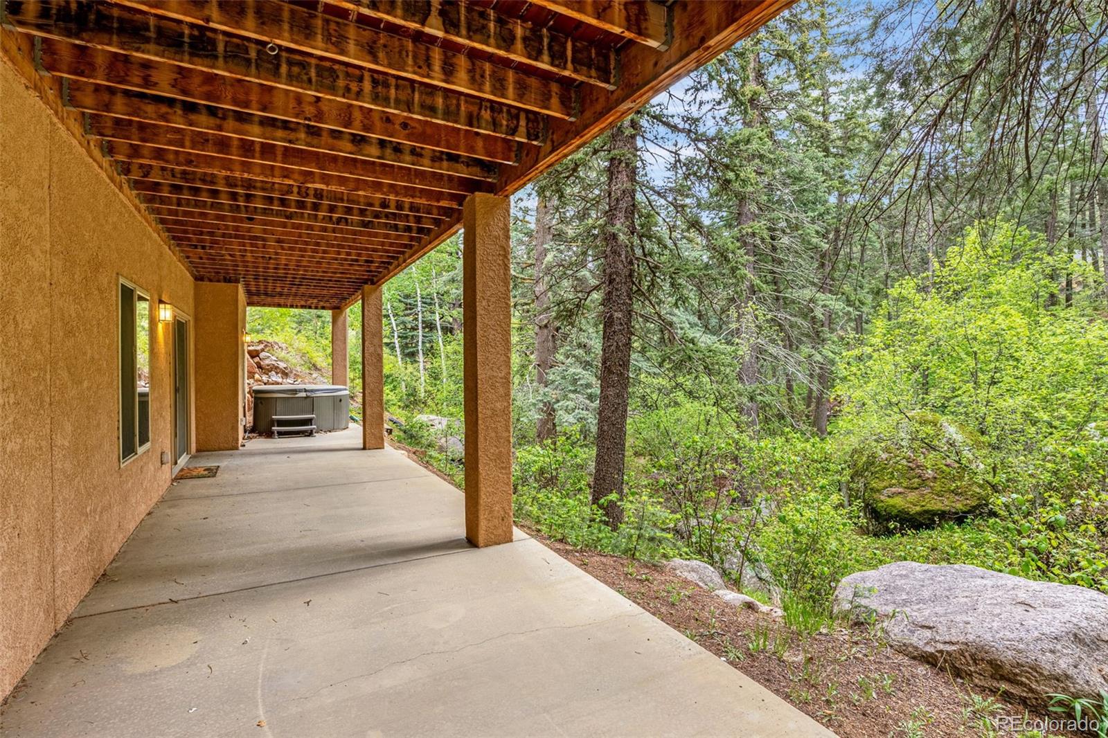 4775 Neeper Valley Road Manitou Springs, CO 80829 - Photo 32 of 41 a view of a porch
