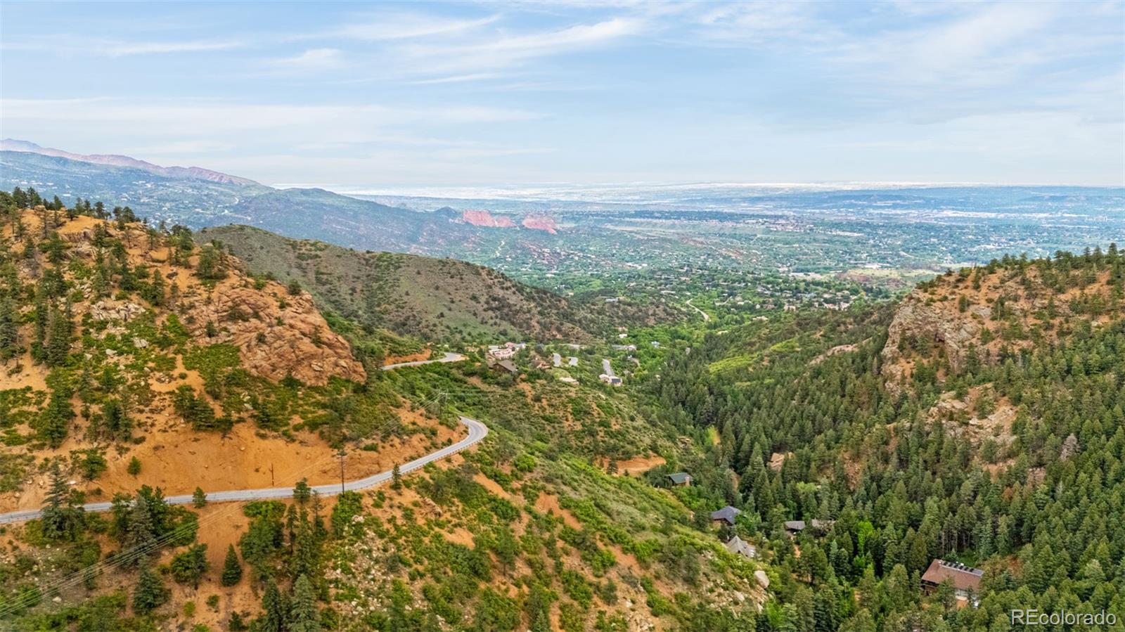 4775 Neeper Valley Road Manitou Springs, CO 80829 - Photo 37 of 41 an aerial view of houses covered in trees