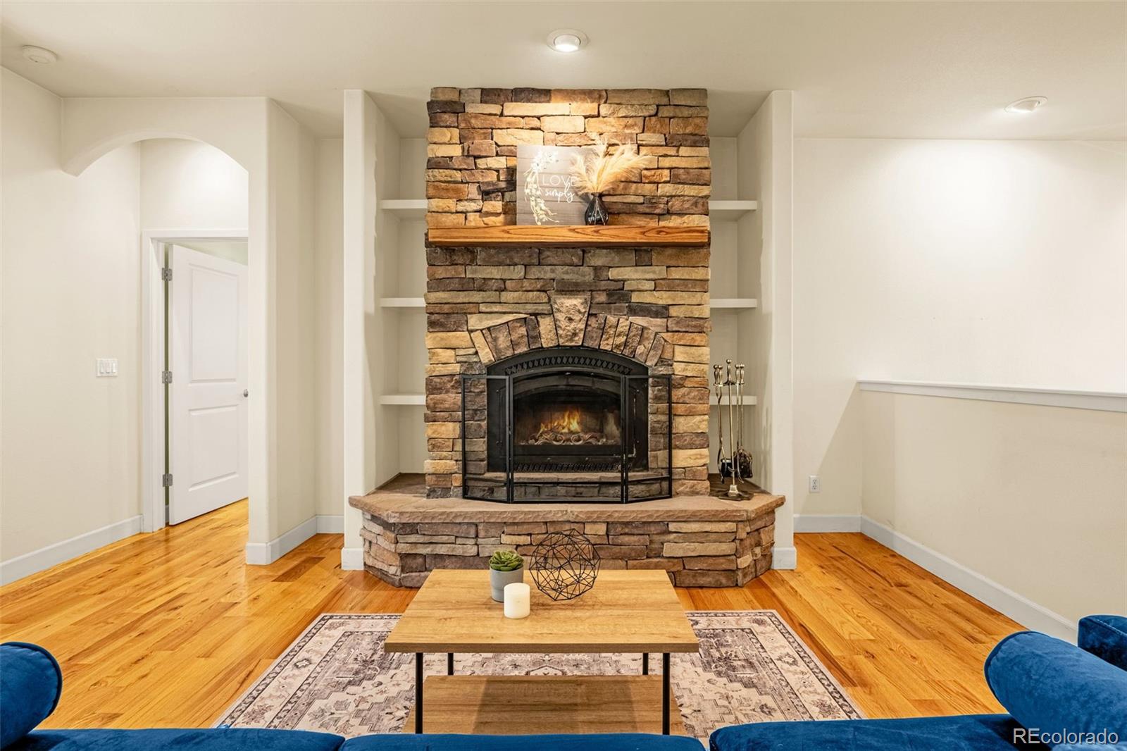 4775 Neeper Valley Road Manitou Springs, CO 80829 - Photo 4 of 41 a living room with furniture and a fireplace