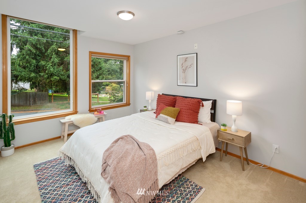 9415 Northeast 175th Street Bothell, WA 98011 - Photo 22 of 35 a bedroom with a large bed and a large window