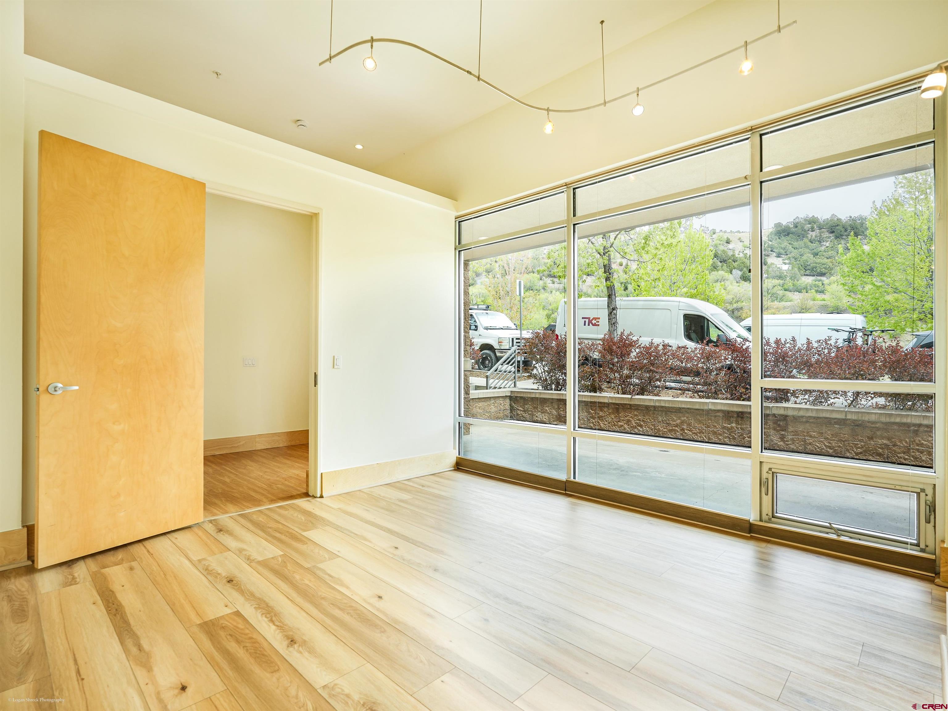 555 Rivergate Lane, Unit B2139 Durango, CO 81301 - Photo 17 of 32 a view of empty room with wooden floor and floor to ceiling window