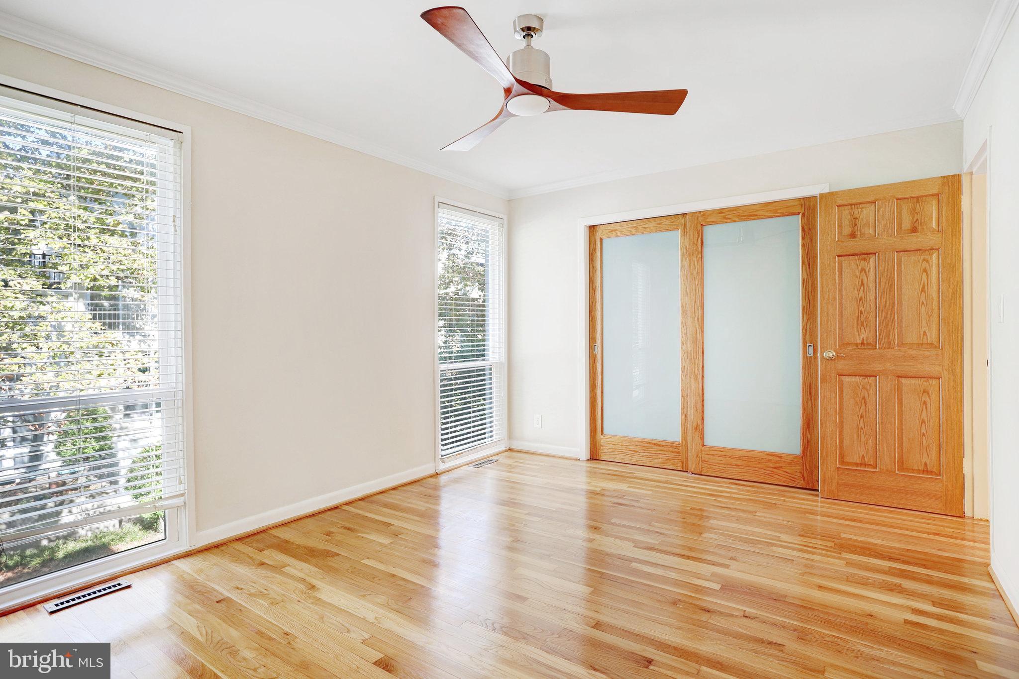 42 G Street Southwest Washington, DC 20024 - Photo 17 of 54 a view of an empty room with wooden floor and a window