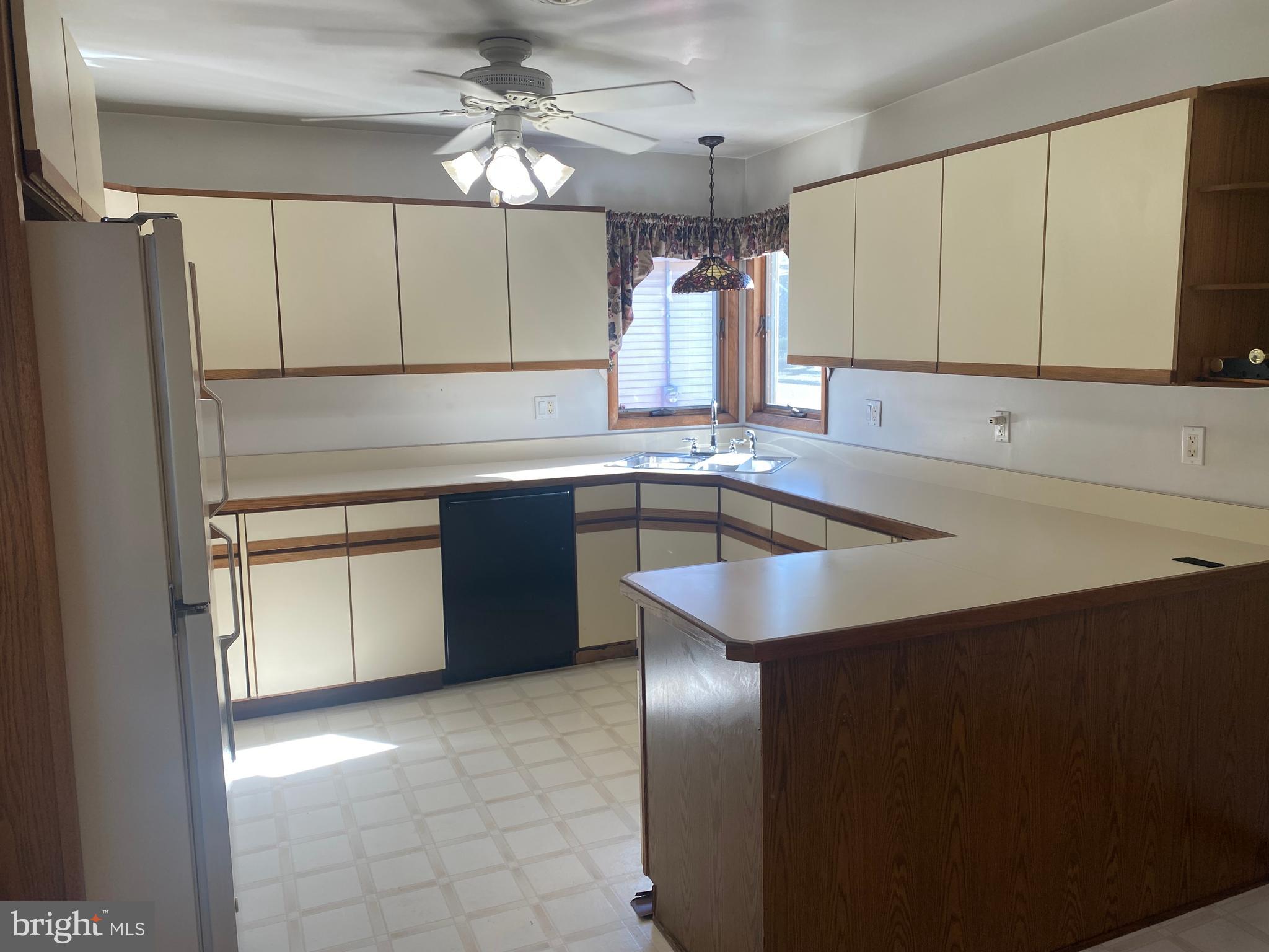 18 Alden Avenue Delran, NJ 08075 - Photo 14 of 32 a kitchen with a sink a counter top space stainless steel appliances and cabinets