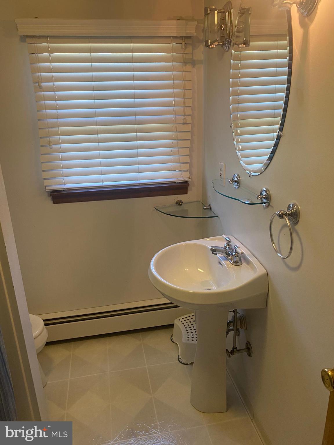 18 Alden Avenue Delran, NJ 08075 - Photo 28 of 32 a bathroom with a sink and a mirror