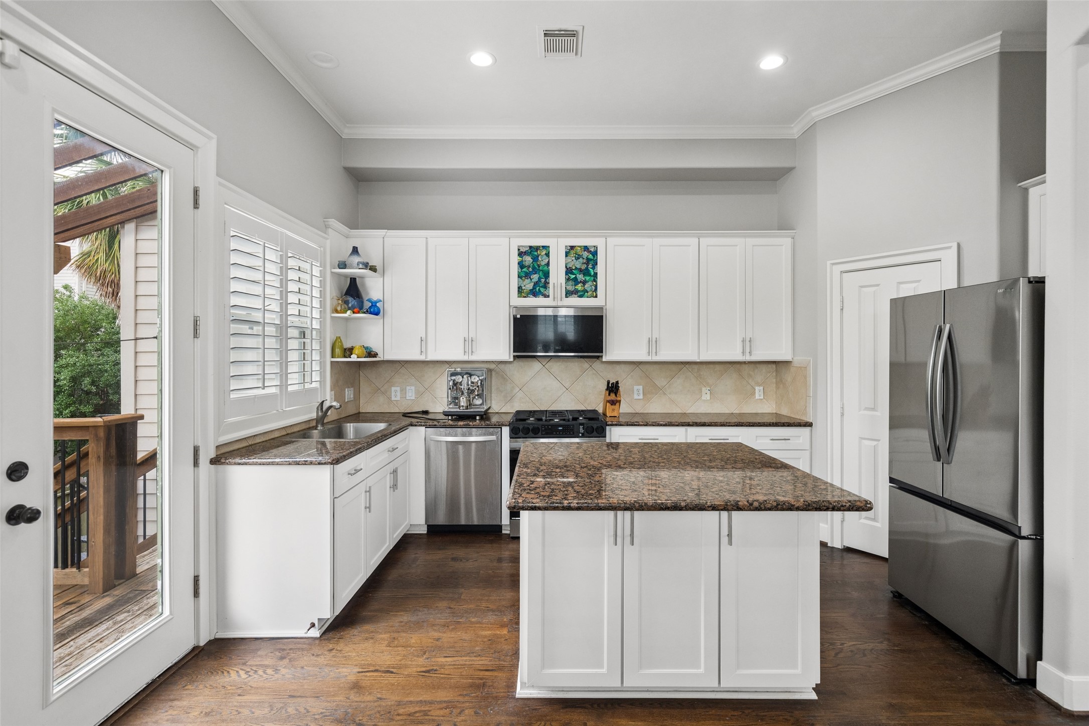 1317 Bomar Street Houston, TX 77006 - Photo 15 of 32 a kitchen with a sink stove and refrigerator