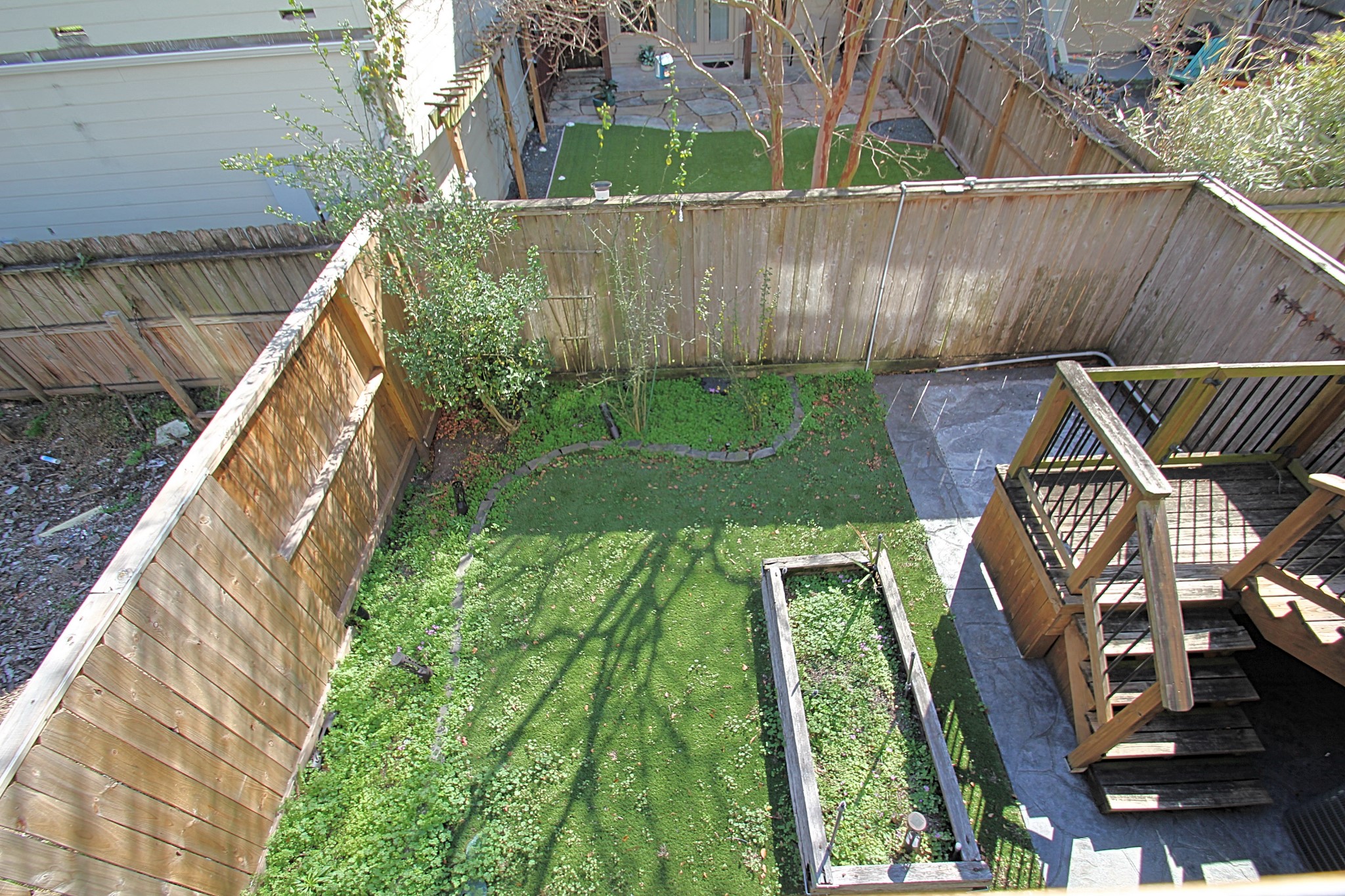 1317 Bomar Street Houston, TX 77006 - Photo 22 of 27 a view of a backyard with sitting area
