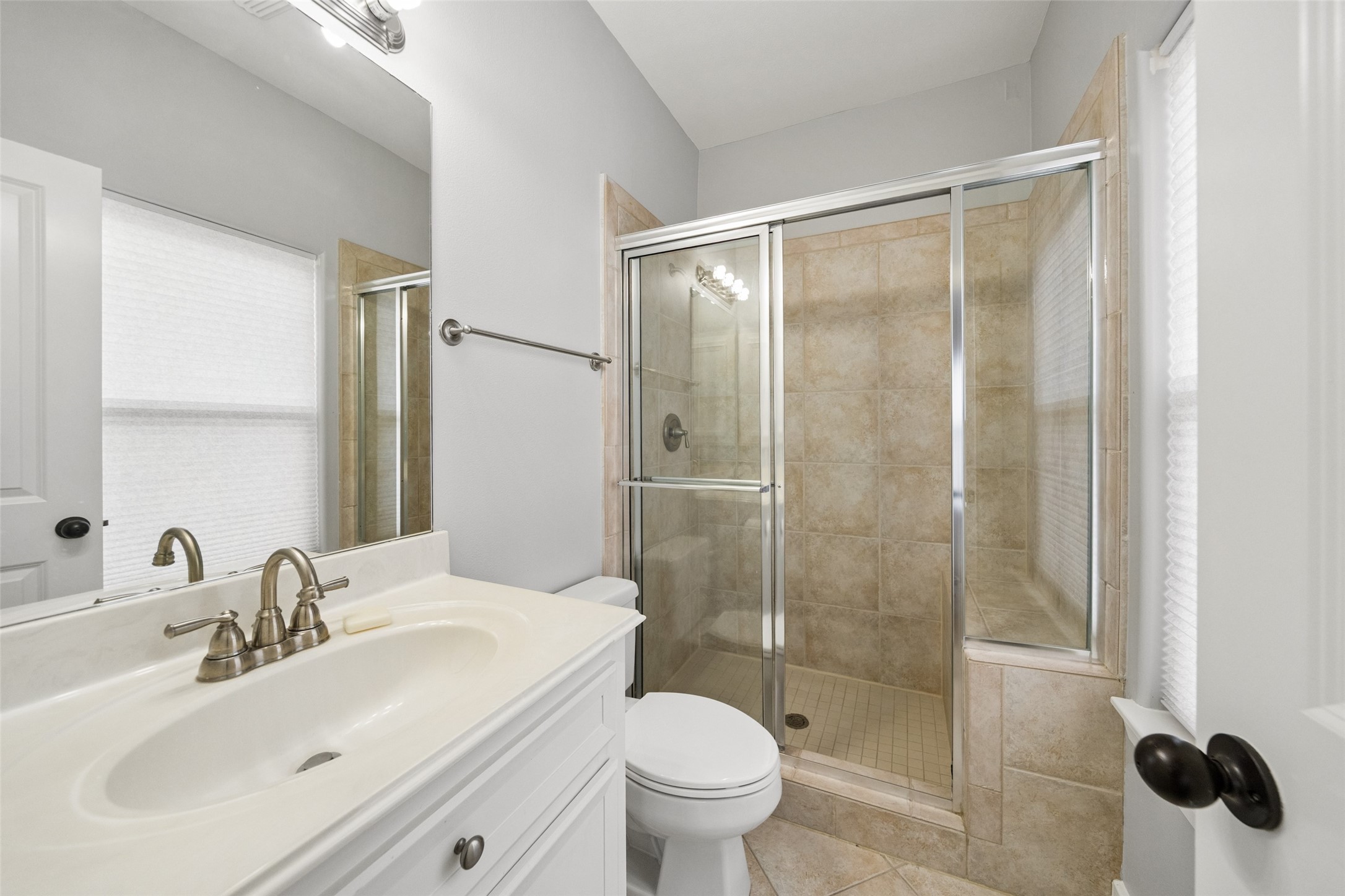 1317 Bomar Street Houston, TX 77006 - Photo 24 of 32 a bathroom with a sink toilet and shower