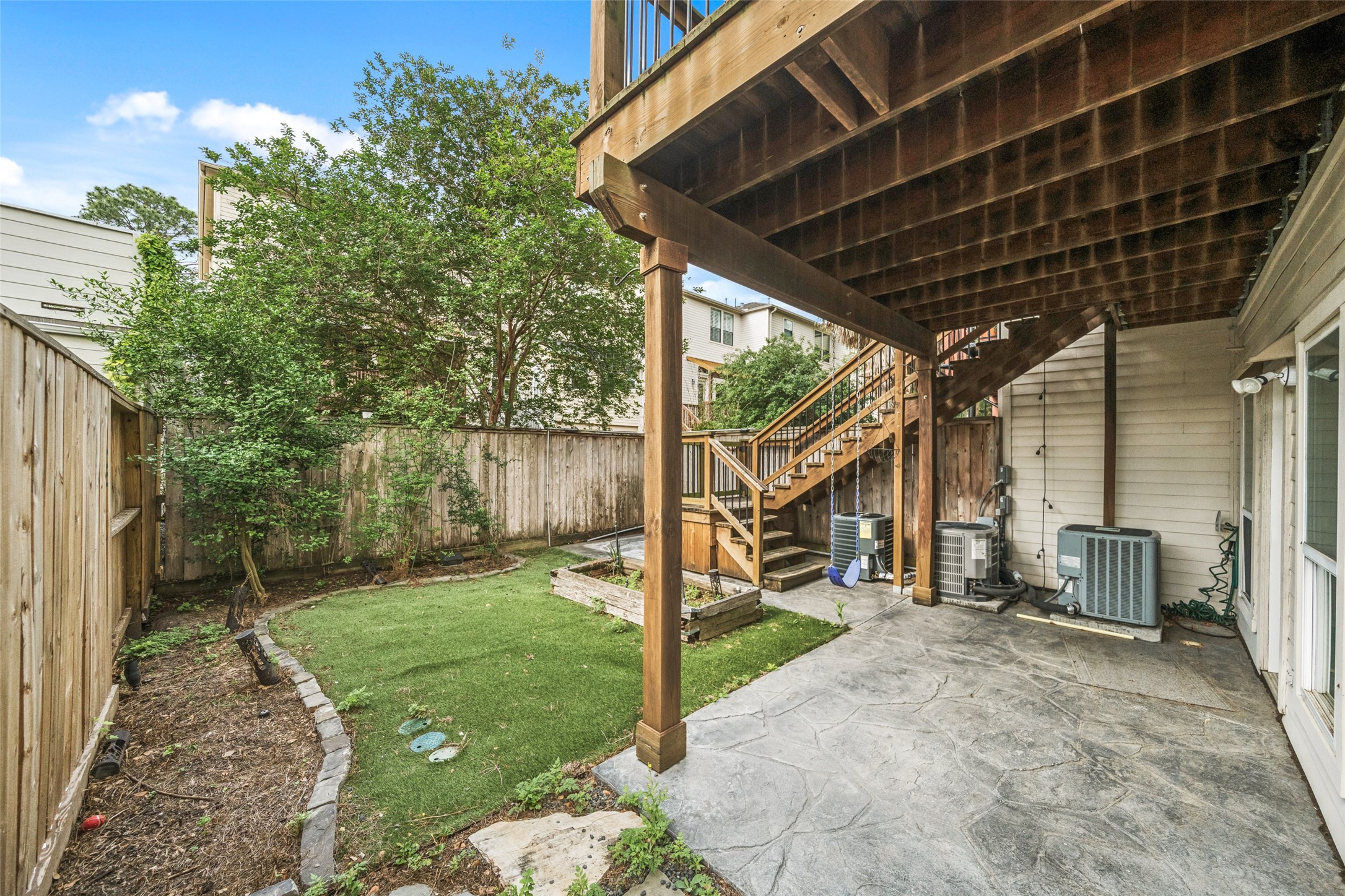 1317 Bomar Street Houston, TX 77006 - Photo 26 of 32 a view of a porch with couches chairs and wooden fence