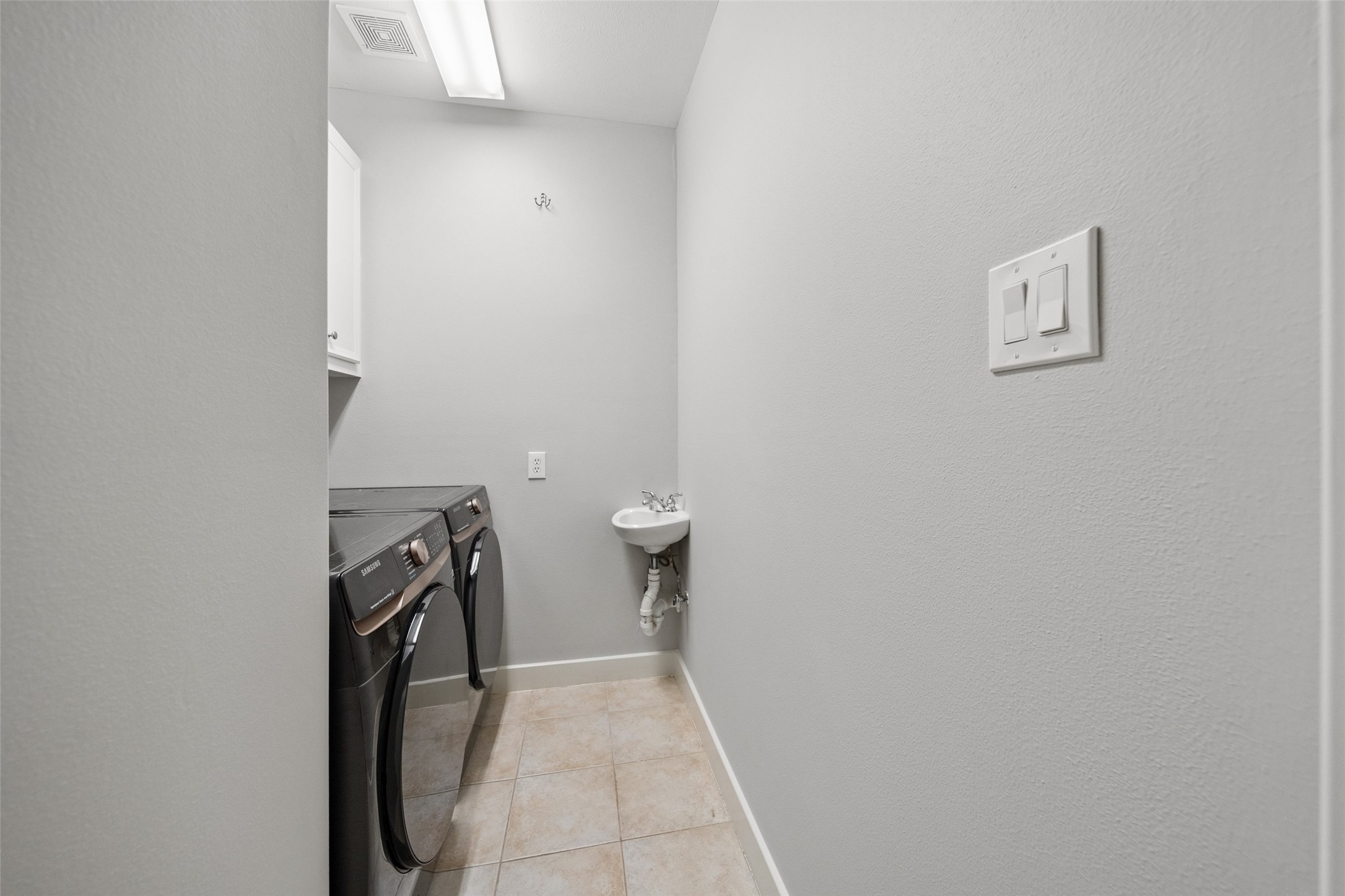 1317 Bomar Street Houston, TX 77006 - Photo 29 of 32 wooden floor in a utility room