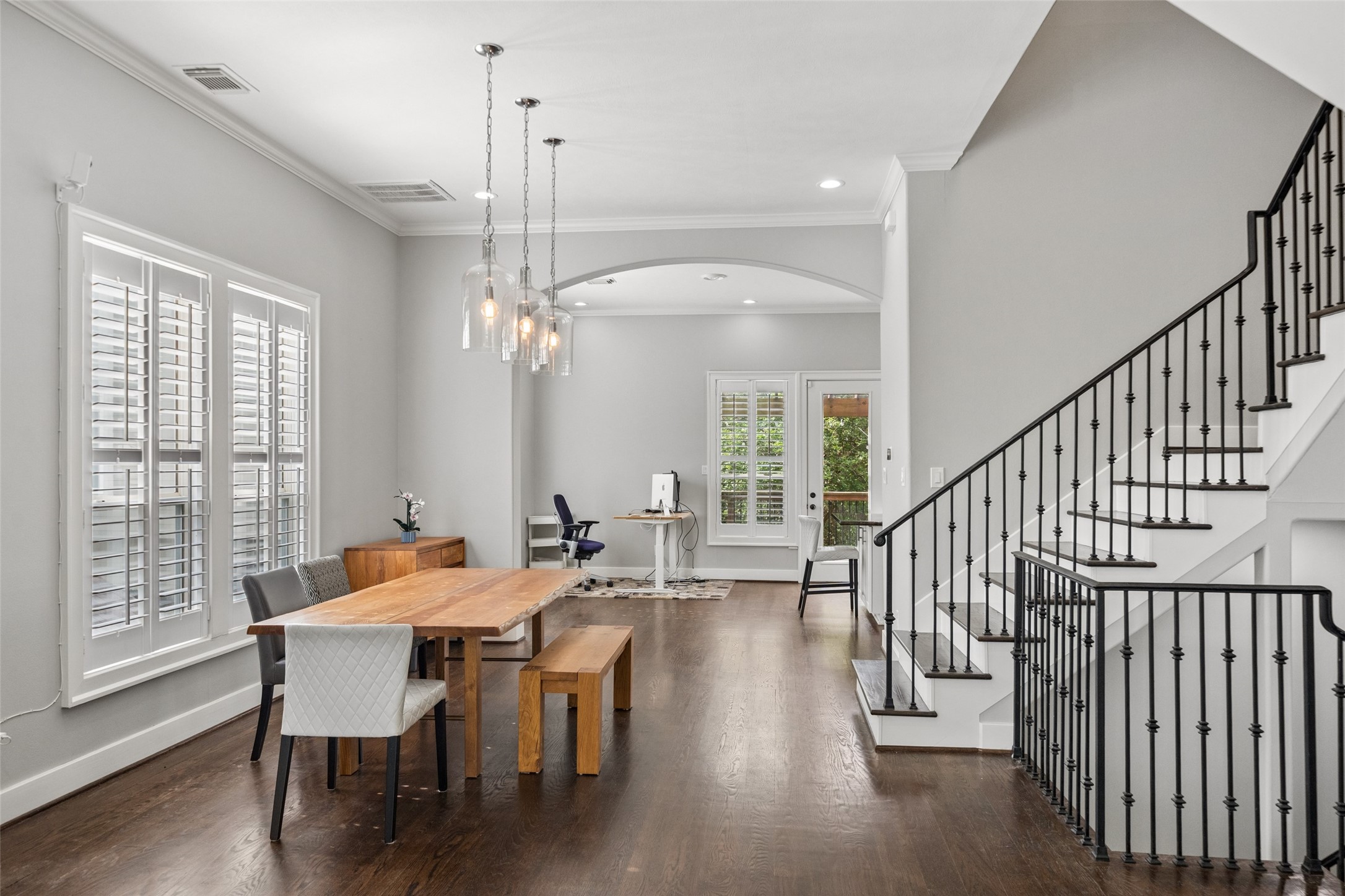 1317 Bomar Street Houston, TX 77006 - Photo 6 of 32 a view of a dining room with furniture window and wooden floor