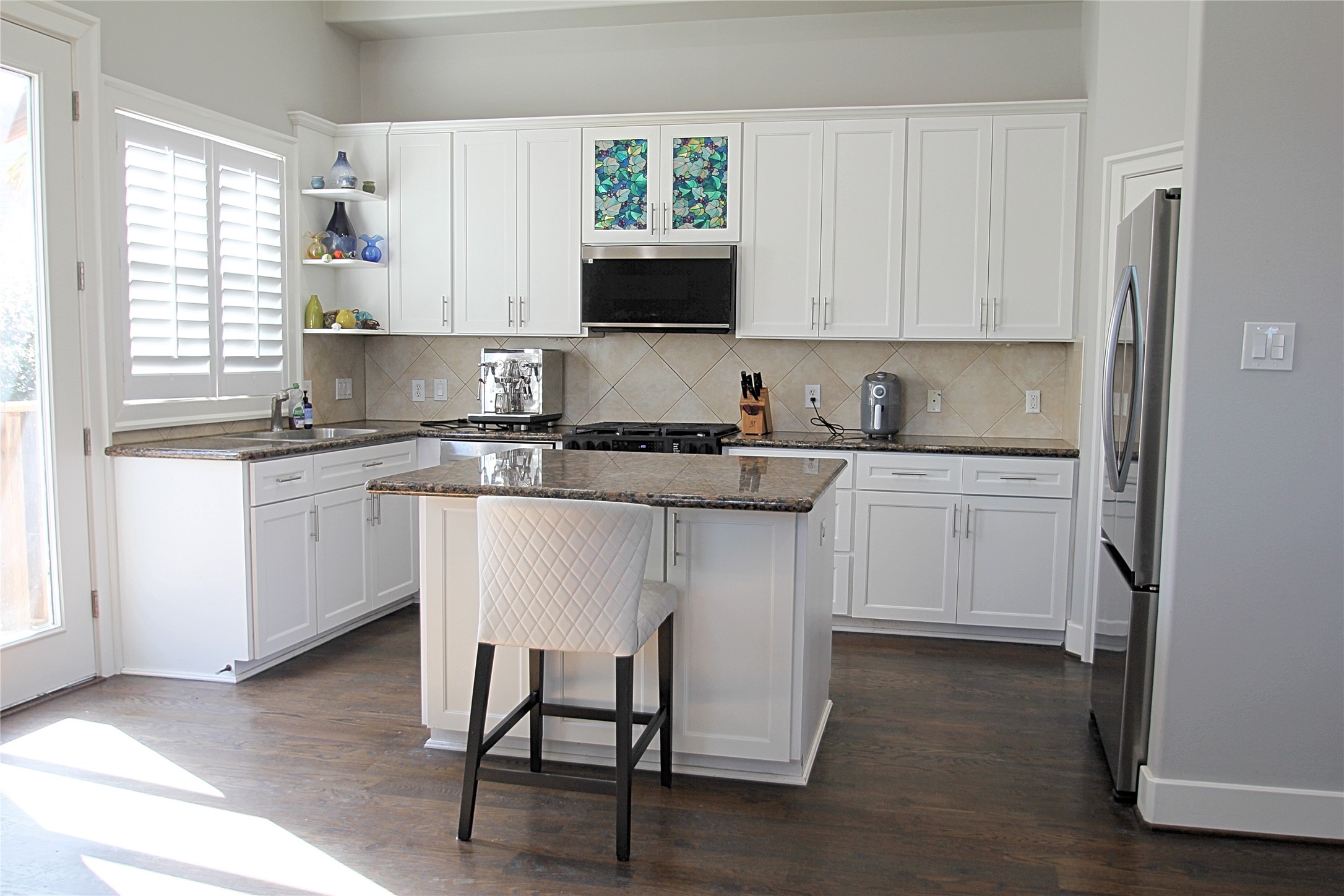 1317 Bomar Street Houston, TX 77006 - Photo 6 of 27 a kitchen with a sink cabinets and window