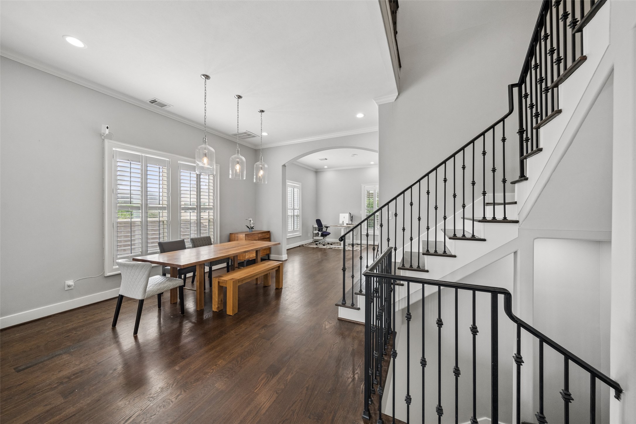1317 Bomar Street Houston, TX 77006 - Photo 7 of 32 a view of a dining room with furniture window and wooden floor