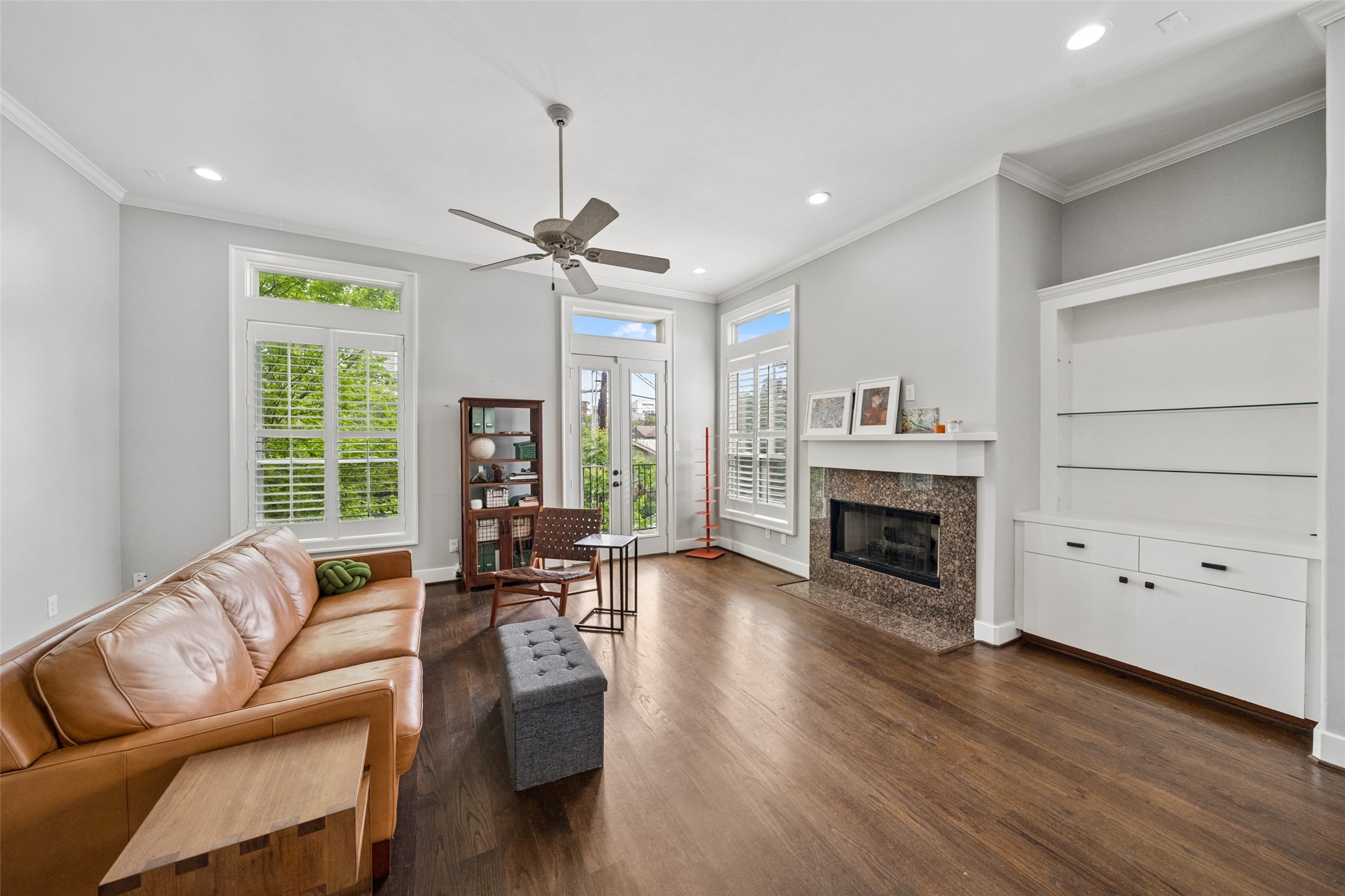1317 Bomar Street Houston, TX 77006 - Photo 8 of 32 a living room with furniture a fireplace and a large window