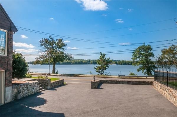 2 Lakeshore Drive Wakefield, MA 01880 - Photo 21 of 29 a view of a swimming pool and a yard