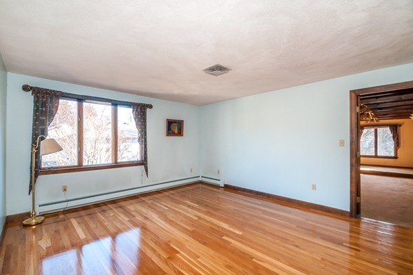2 Lakeshore Drive Wakefield, MA 01880 - Photo 23 of 29 an empty room with wooden floor and windows