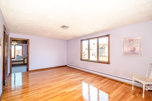 2 Lakeshore Drive Wakefield, MA 01880 - Photo 24 of 29 a view of an empty room with wooden floor and a window