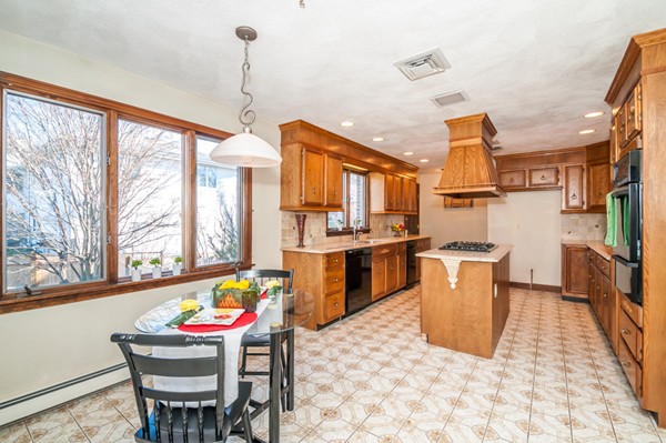 2 Lakeshore Drive Wakefield, MA 01880 - Photo 29 of 29 a dining room with furniture a window and a kitchen view