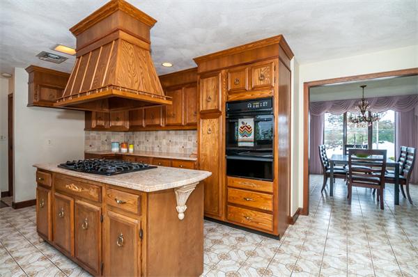 2 Lakeshore Drive Wakefield, MA 01880 - Photo 6 of 29 a kitchen with stainless steel appliances granite countertop a stove and a sink