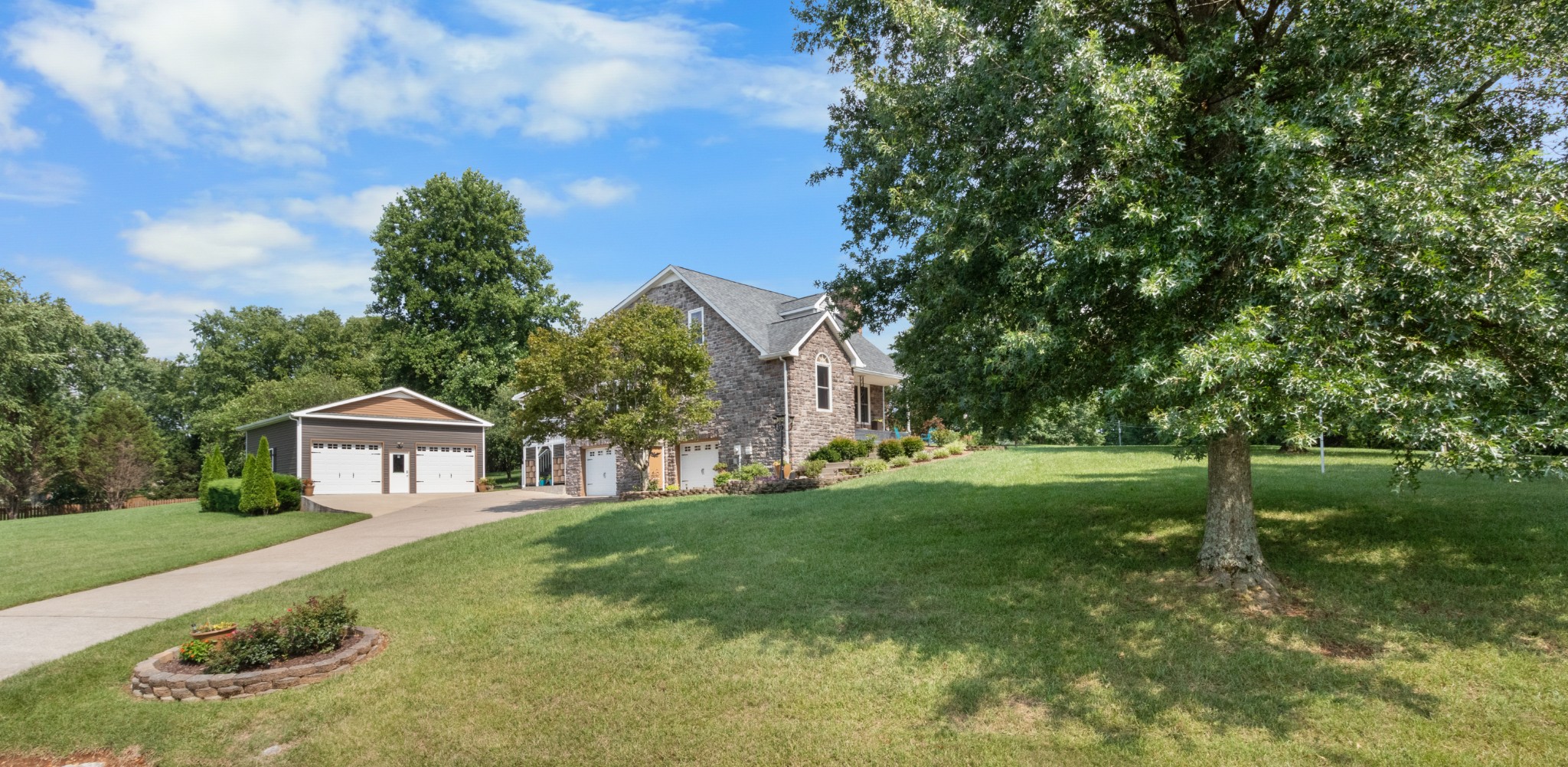 a front view of a house with garden