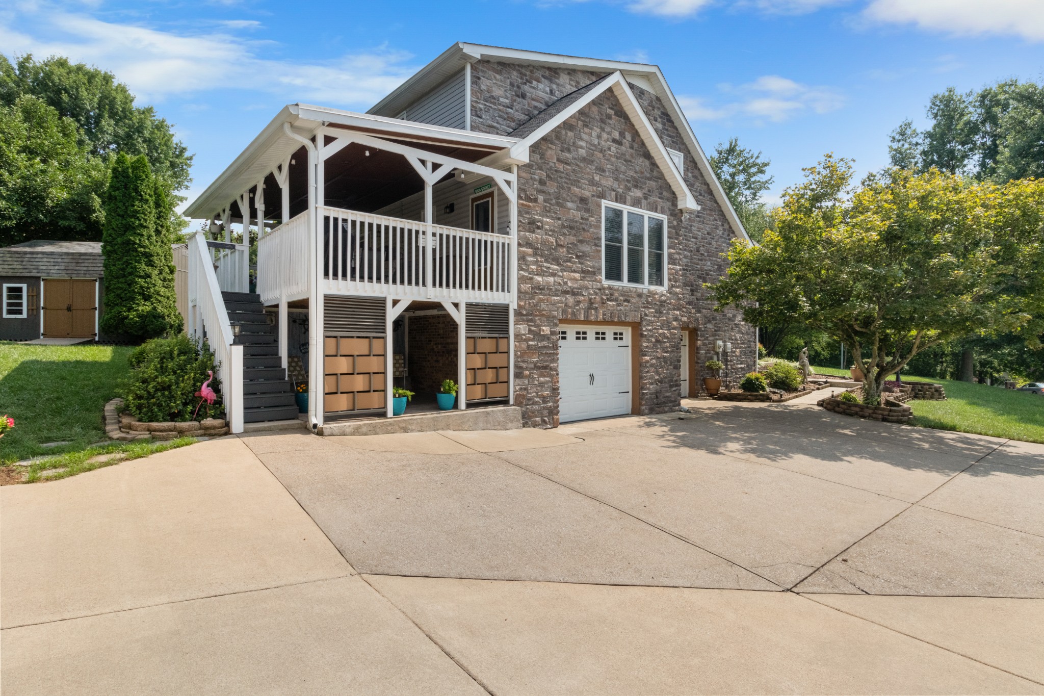 901 Riverchase Road Adams, TN 37010 - Photo 2 of 35 a front view of a house with a yard and garage