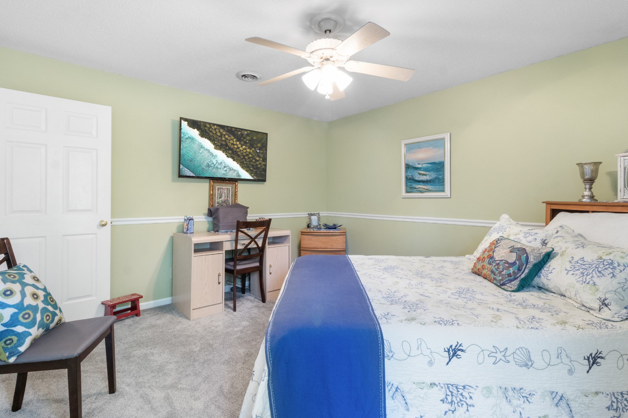 901 Riverchase Road Adams, TN 37010 - Photo 22 of 35 a bedroom with a bed and a chandelier