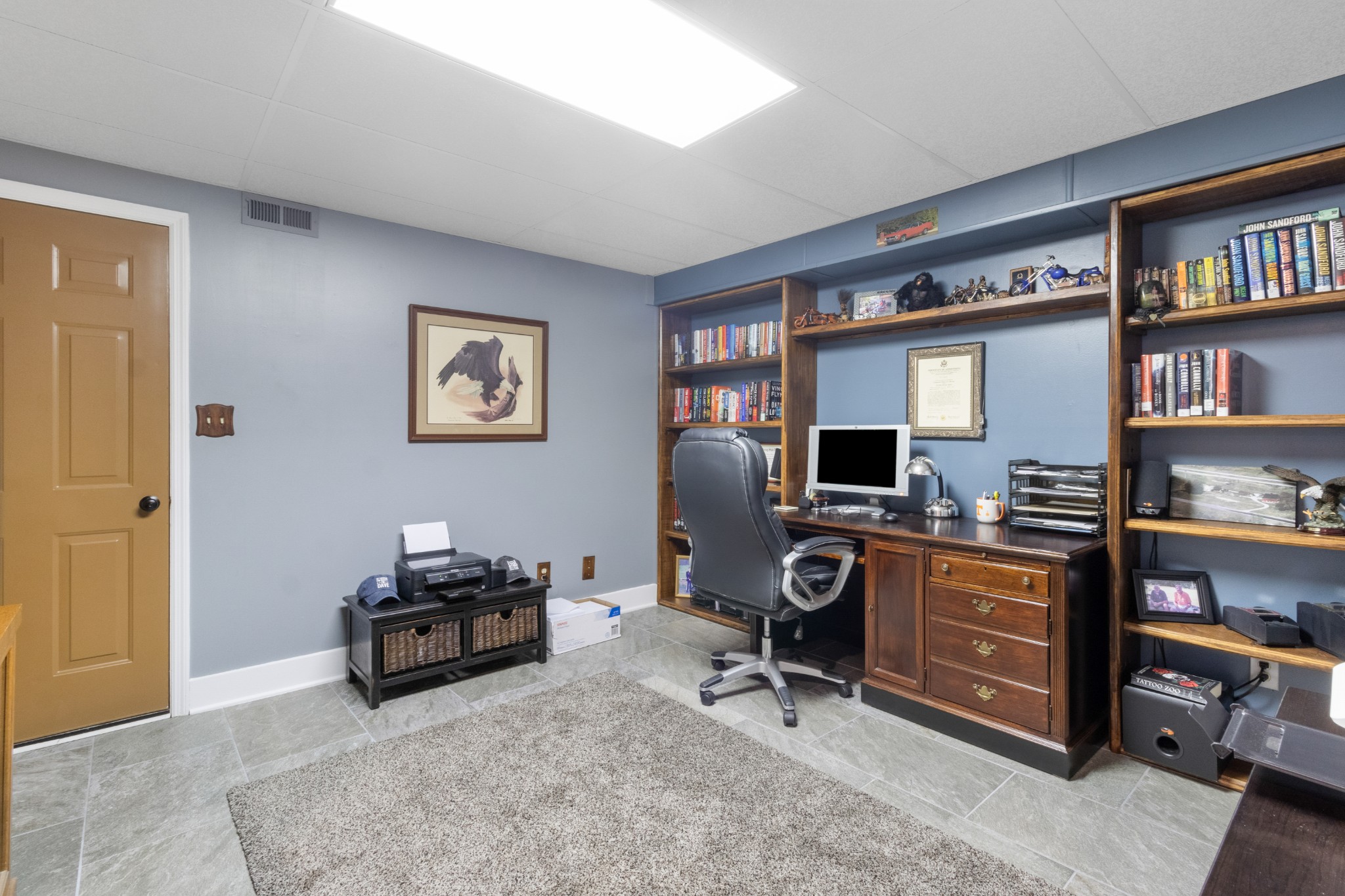 901 Riverchase Road Adams, TN 37010 - Photo 24 of 35 a view of a workspace with a bookshelf