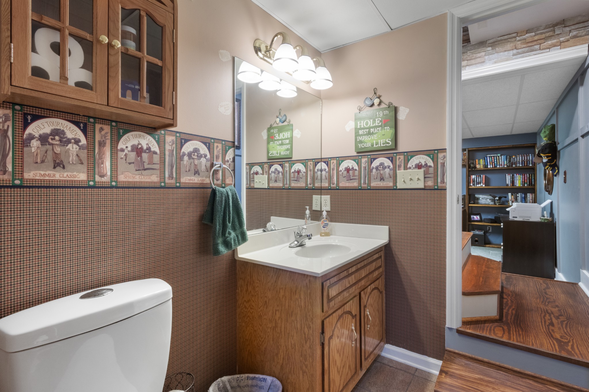 901 Riverchase Road Adams, TN 37010 - Photo 25 of 35 a bathroom with a toilet a sink and a mirror