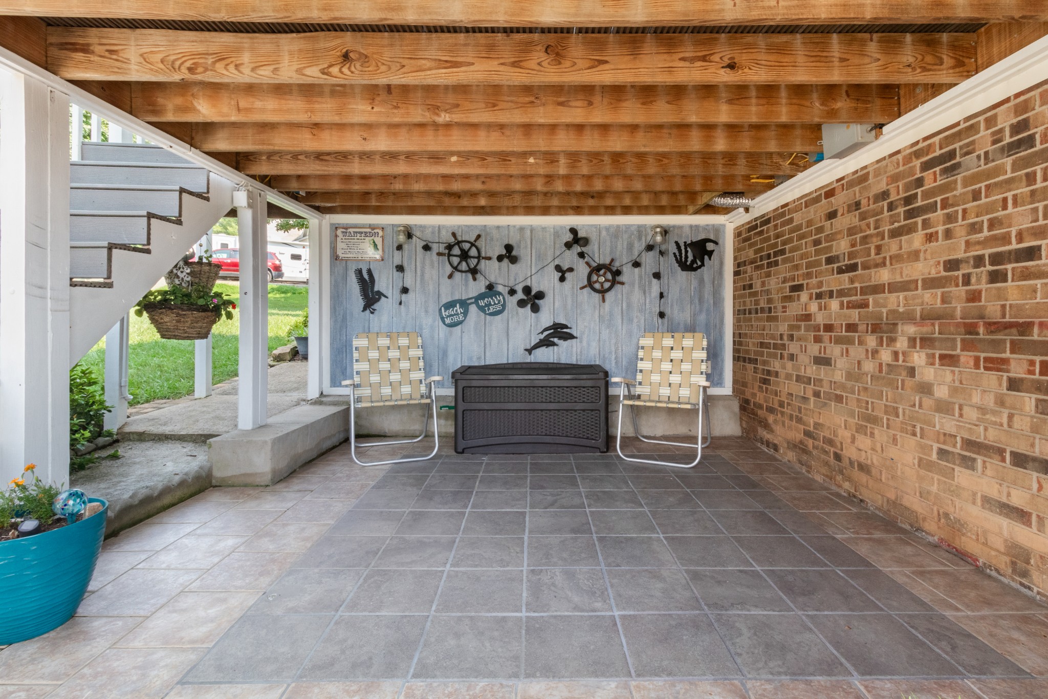 901 Riverchase Road Adams, TN 37010 - Photo 27 of 35 a view of a patio with table and chairs potted plants