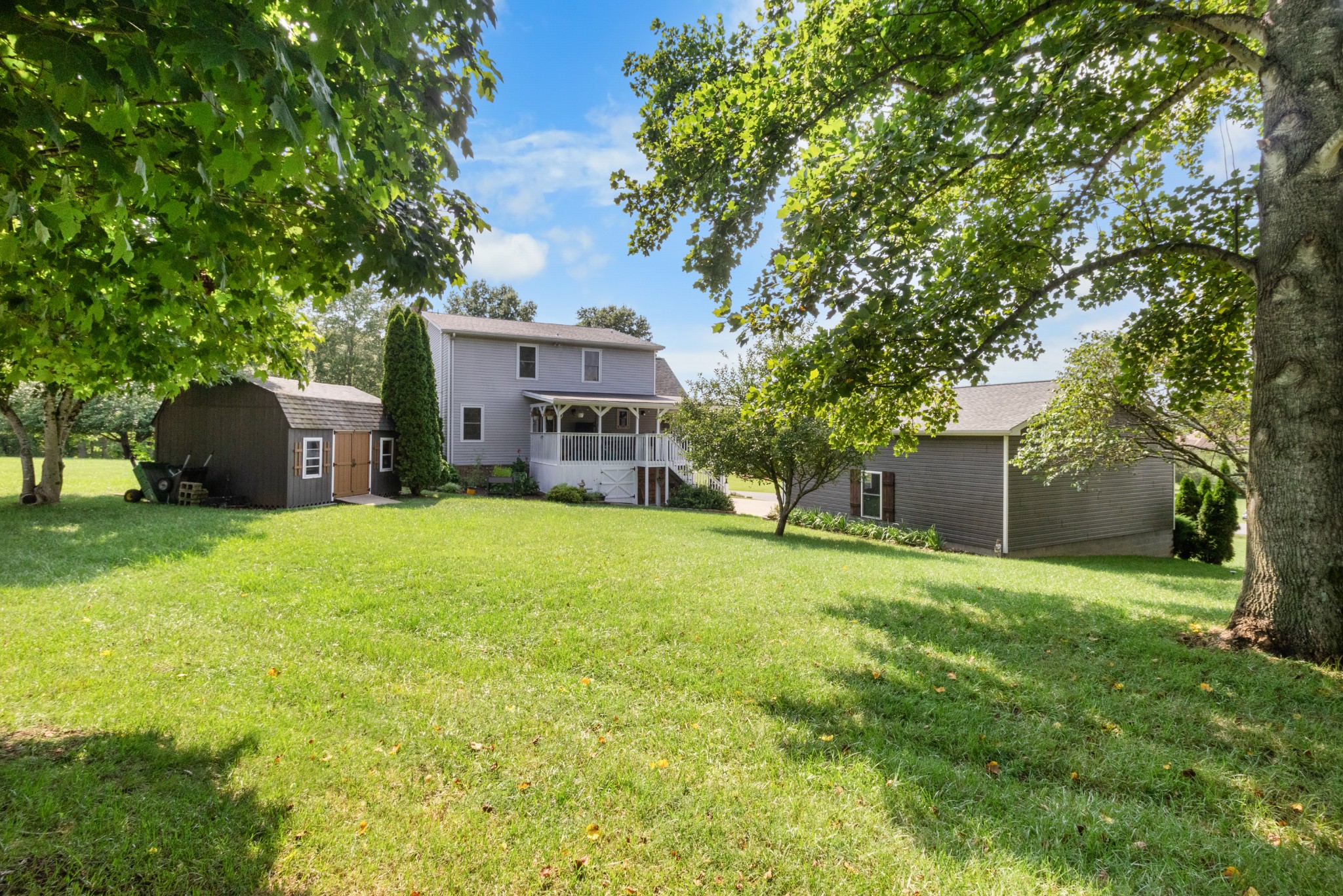 901 Riverchase Road Adams, TN 37010 - Photo 29 of 35 a view of a house with a yard and large tree
