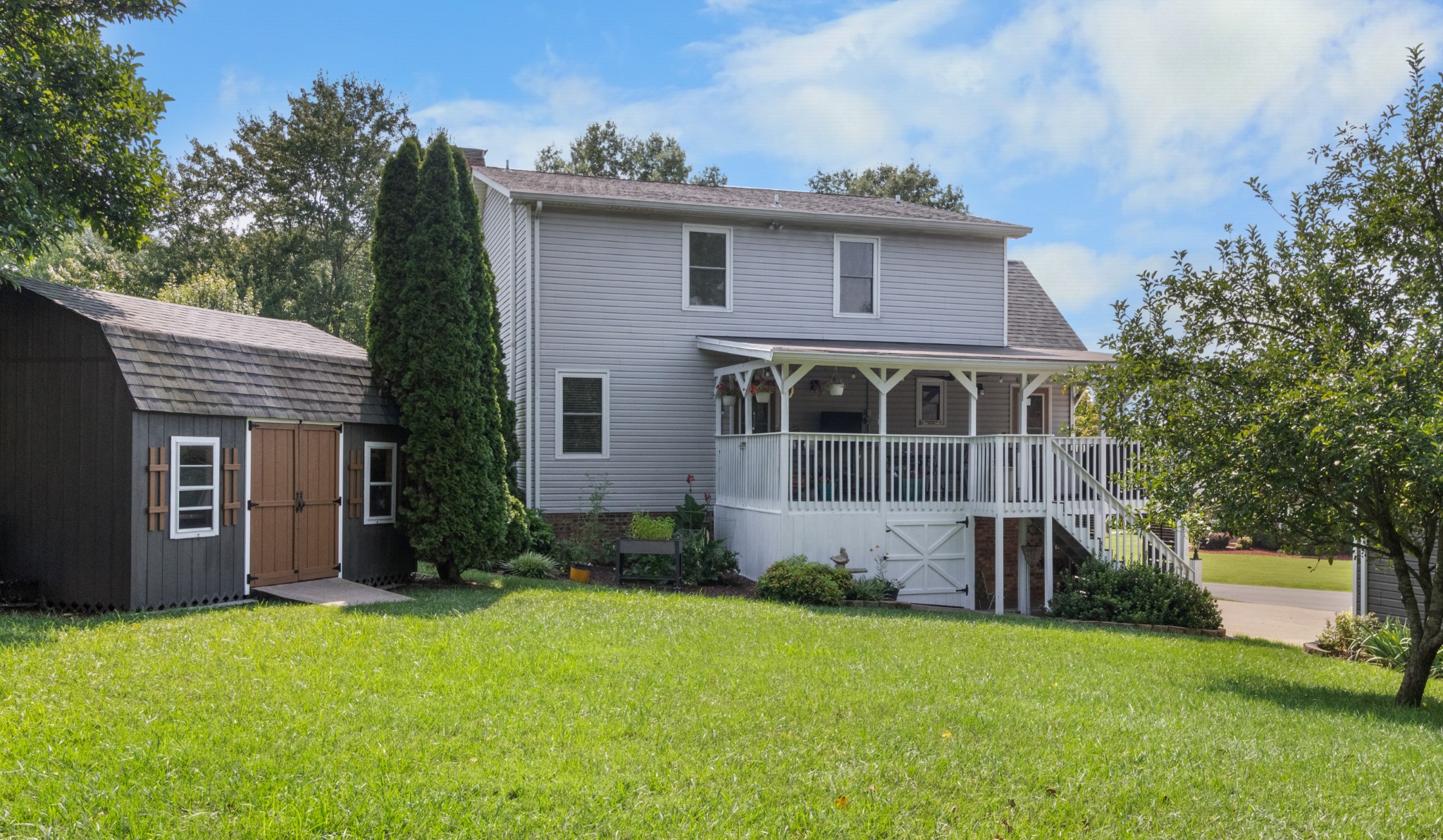 901 Riverchase Road Adams, TN 37010 - Photo 30 of 35 a front view of a house with garden